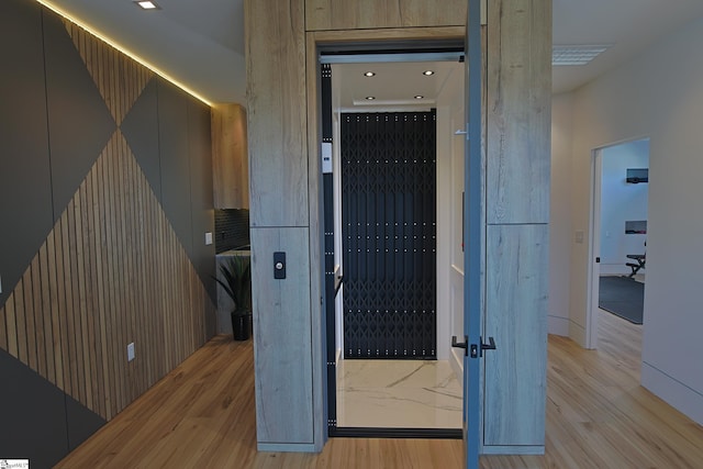 hall with light wood-type flooring