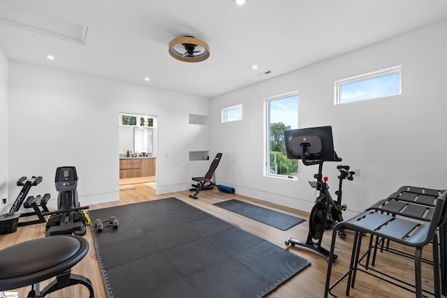 workout room with wood-type flooring