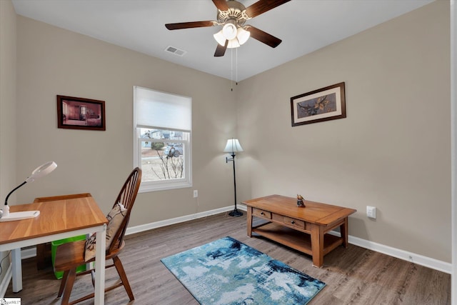 office space featuring ceiling fan and light hardwood / wood-style flooring