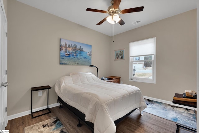 bedroom featuring dark wood-type flooring and ceiling fan