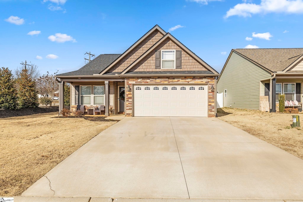 view of front of house with a garage and covered porch