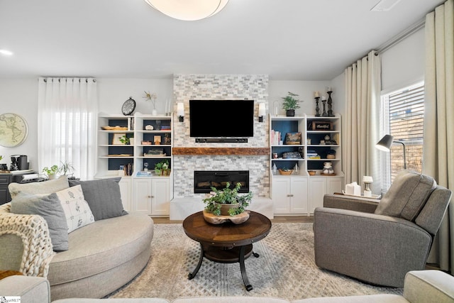 living room with a fireplace and light hardwood / wood-style floors