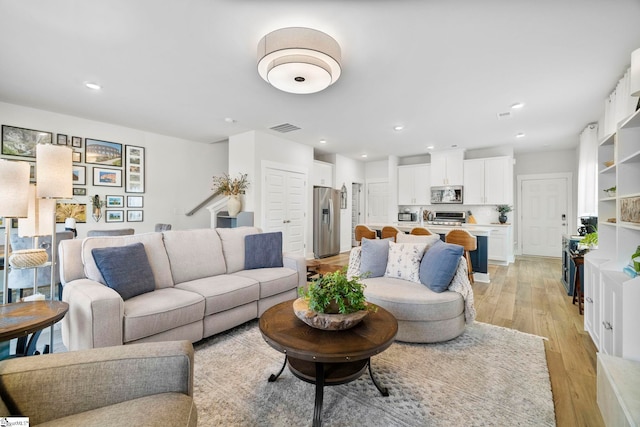 living room with light hardwood / wood-style floors