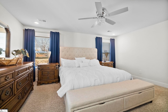 bedroom featuring light carpet and ceiling fan