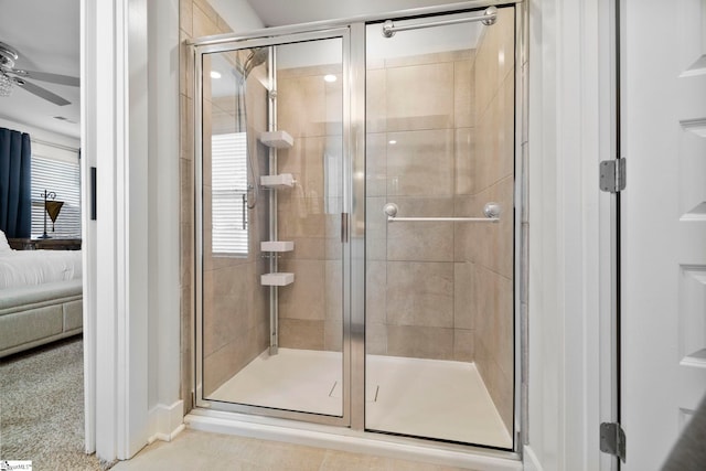 bathroom with an enclosed shower, plenty of natural light, and ceiling fan