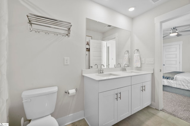 bathroom featuring vanity, ceiling fan, and toilet