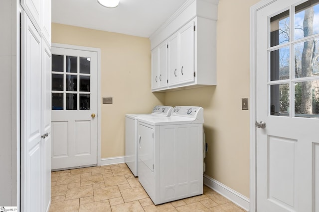 washroom featuring cabinets and washer and dryer