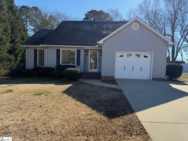 single story home featuring a garage and a front lawn