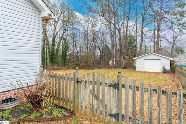 view of yard featuring an outbuilding and a garage