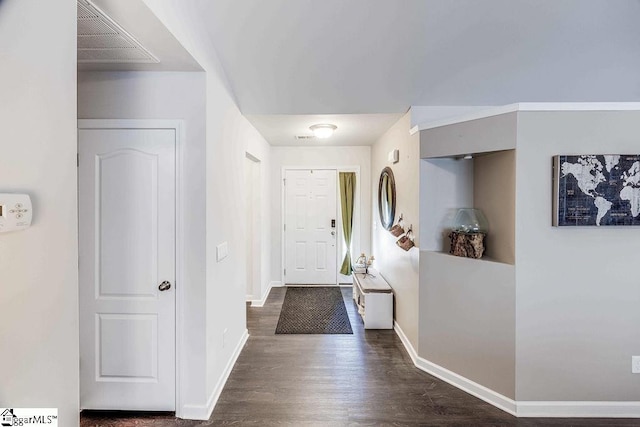 entryway featuring dark wood-style floors, visible vents, and baseboards