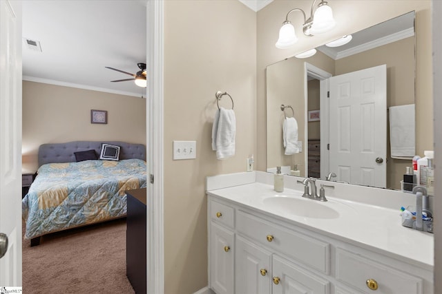 bathroom with ornamental molding, vanity, and ceiling fan