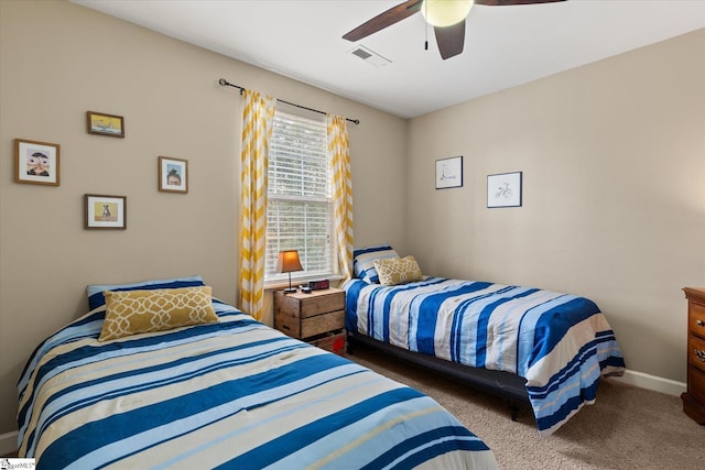 bedroom with ceiling fan and carpet floors