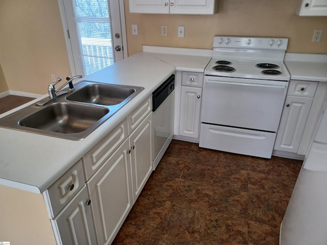 kitchen featuring white appliances, kitchen peninsula, sink, and white cabinets