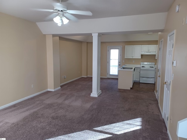 kitchen featuring vaulted ceiling, sink, white cabinets, dark carpet, and white range with electric cooktop