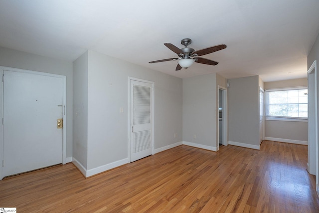 empty room featuring ceiling fan and light wood-type flooring