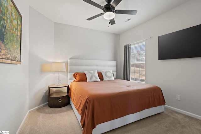 bedroom with ceiling fan and carpet