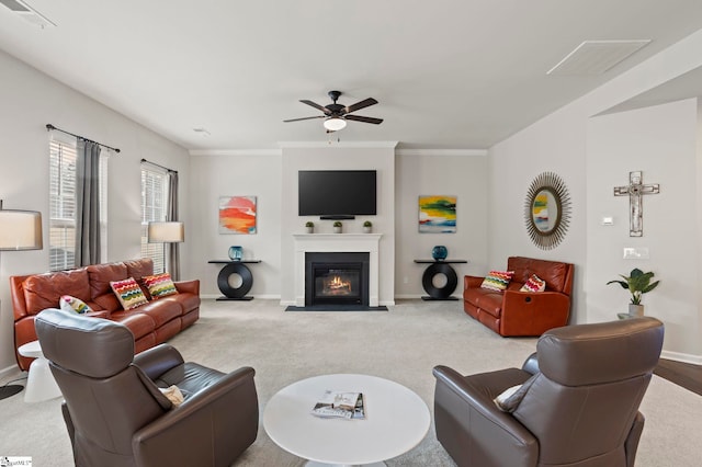 living room featuring ornamental molding, light colored carpet, and ceiling fan