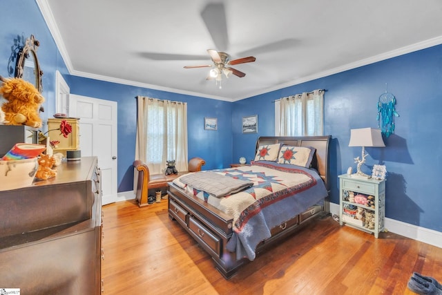 bedroom featuring crown molding, ceiling fan, and light wood-type flooring