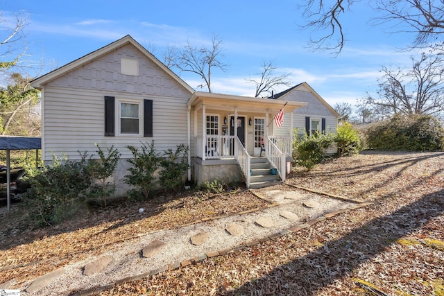 single story home featuring covered porch