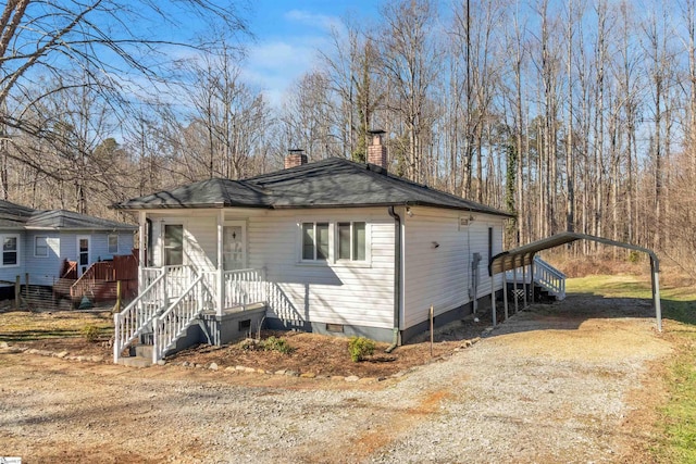 view of front of house featuring a carport