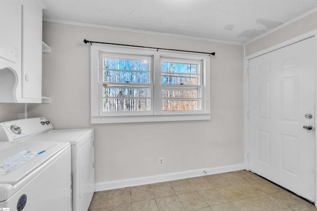 laundry area with cabinets, ornamental molding, a textured ceiling, and independent washer and dryer