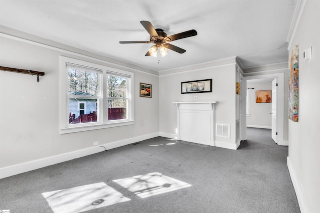 carpeted spare room with crown molding and ceiling fan