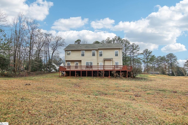 back of property with a yard and a deck