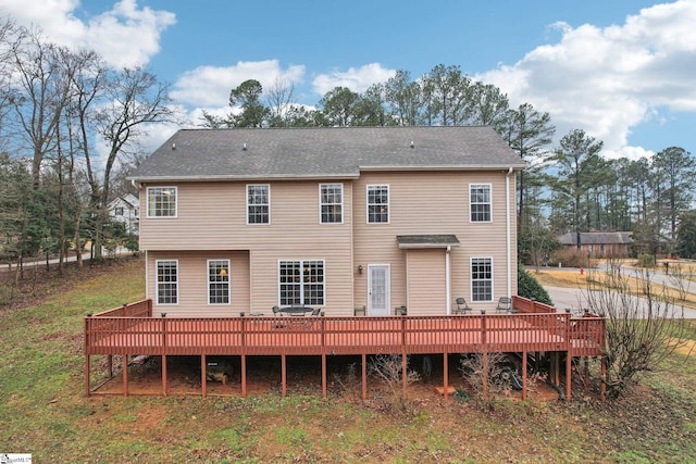 rear view of property with a deck