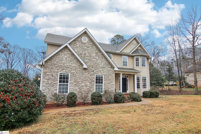 craftsman-style house with a front yard