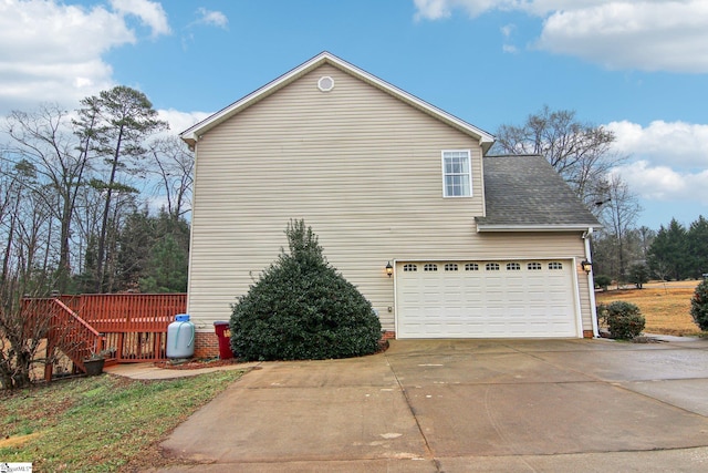 view of side of home with a garage