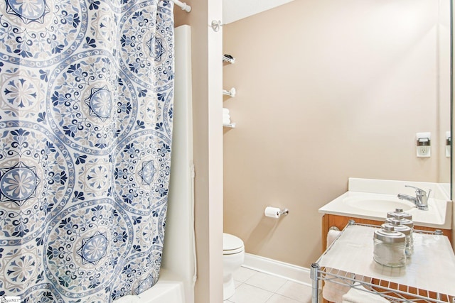 bathroom featuring tile patterned flooring, vanity, toilet, and a shower with shower curtain