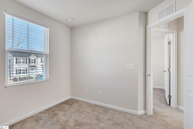 carpeted spare room with plenty of natural light