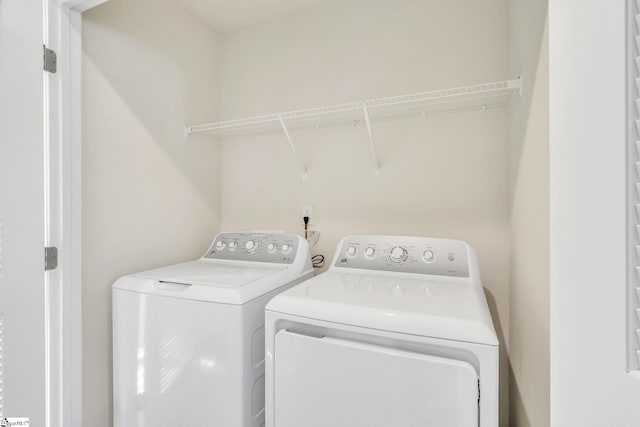 washroom featuring separate washer and dryer