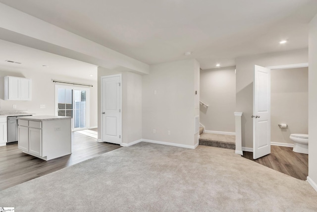 unfurnished living room featuring carpet flooring