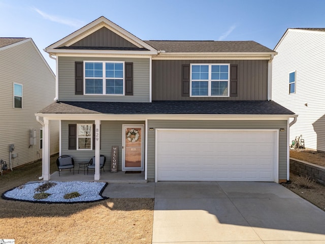 view of front property featuring a garage and covered porch