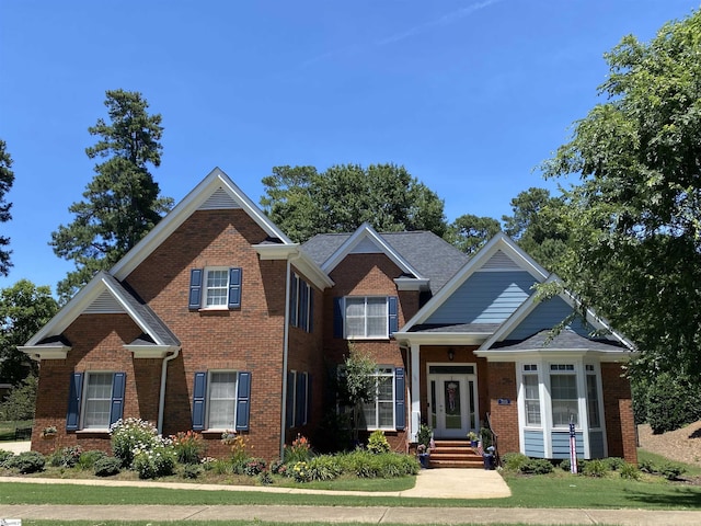 craftsman-style home with a front yard