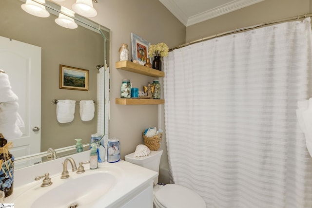 bathroom featuring vanity, ornamental molding, and toilet