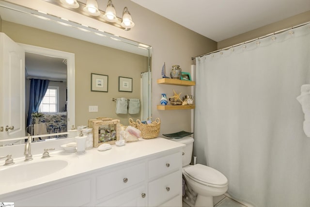 bathroom with vanity and toilet