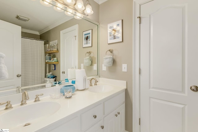 bathroom with vanity, crown molding, and a shower with curtain