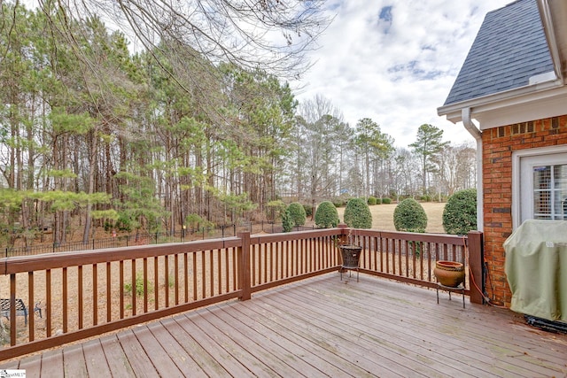 wooden terrace featuring grilling area