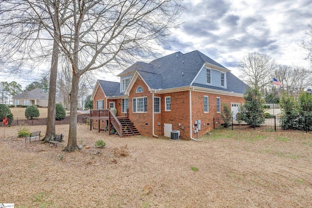 back of house featuring cooling unit and a wooden deck