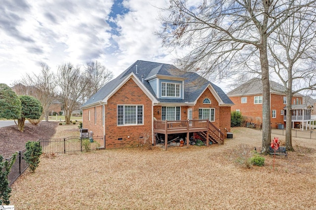 back of property with a wooden deck and central AC unit