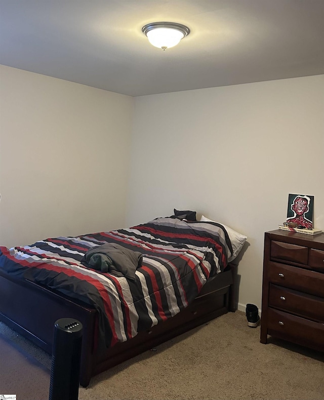 bedroom with light colored carpet