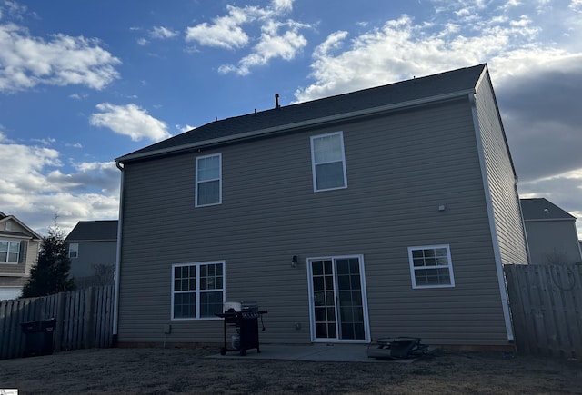 rear view of property featuring a patio