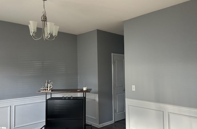 kitchen featuring dark hardwood / wood-style floors and a notable chandelier