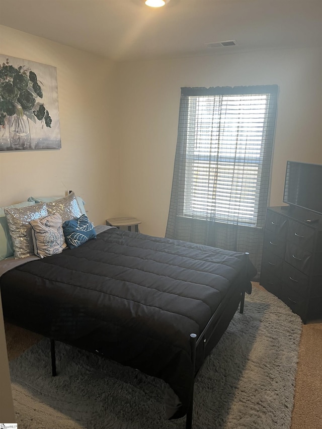 bedroom featuring carpet