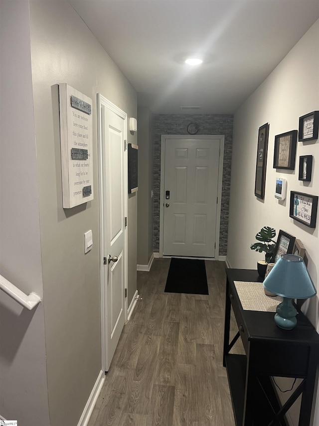 hall with dark hardwood / wood-style flooring