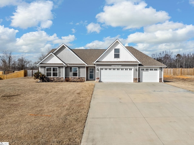 view of front of house featuring a garage and a front lawn