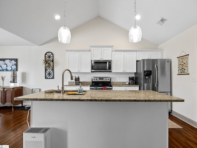 kitchen featuring decorative light fixtures, an island with sink, sink, white cabinets, and stainless steel appliances