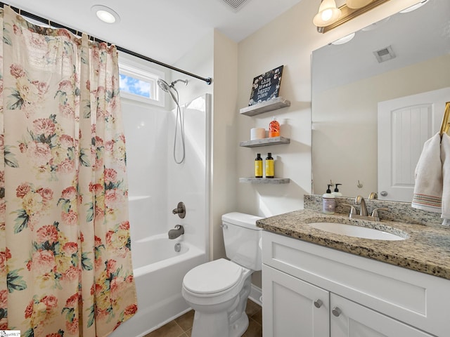 full bathroom with tile patterned flooring, vanity, shower / tub combo, and toilet